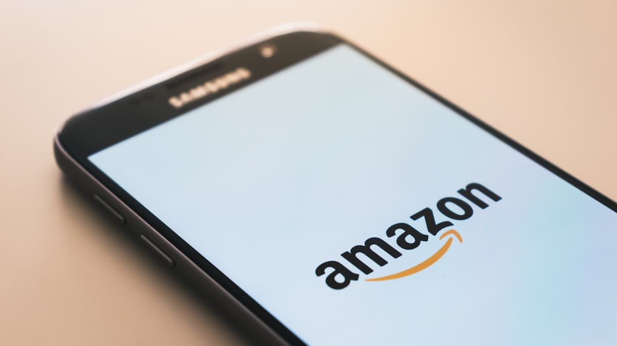 Amazon FBA warehouse with automated inventory management dashboard showing IPI score and restock limits