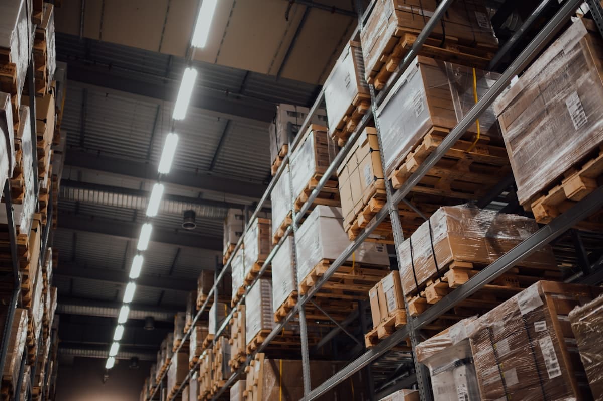 Amazon fulfillment center with FBA and FBM inventory staging areas for hybrid planning